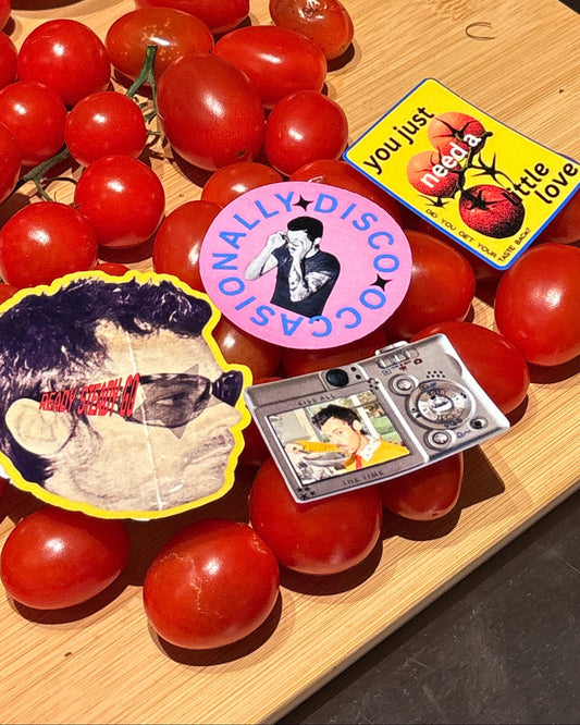 Tomatoes on a cutting board with decorative labels